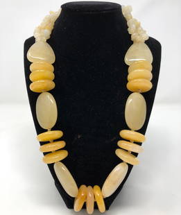 Sterling and Yellow Semi-Precious Beaded Necklace: Description: Gorgeous, chunky large beaded necklace comprised of creamy, pale yellow, agate-like polished stones, with hallmarked sterling silver caps. Adjutable closure with 3" extender. Material: si