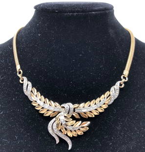 Vintage Trifari Embellished Leaf Necklace: Description: Fabulous gold-plated metal 1950s to 60s embellished leaf necklace from Trifari, featuring lovely Swarovski crystal embellishments and a sleek snake chain with extender. Trifari etched on