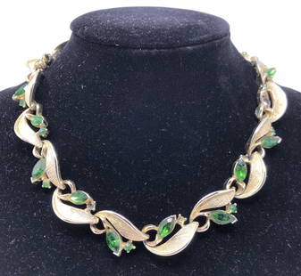 Vintage Coro Gold Tone, Crystal Necklace, Signed: Description: Oh so chic 1950s vintage Coro gold tone, green crystal necklace, signed. Choker-style (very Betty Draper-ish) with burnished gold tone links set with deep green crystals; signed on