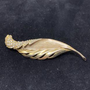 Vintage Shell and Crystal Leaf Brooch: Description: Splendid vintage leaf-shaped gold tone brooch with shell inlay and clear, faceted crystals. Material: metal; shell; glass. Measurement: approximate 3.75" (INCHES). Shipping: $12;