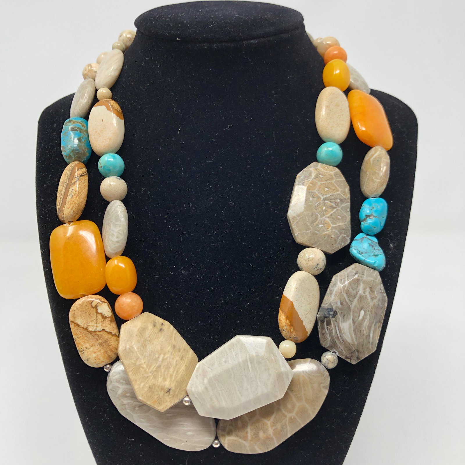 Colorful 2-Strand Stone Necklace: Description: Colorful, 2-strand primitive-style polished stone necklace. The necklace is strung with an array of colorful stones in varying sizes and shapes including orange carnelian agate, blue-gree