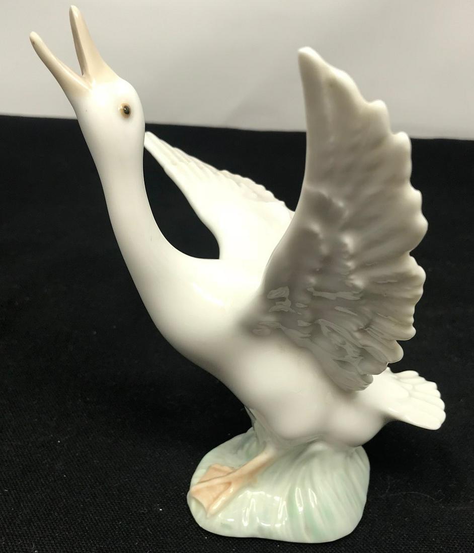 Lladro Porcelain, Goose, wings spread, hand made in: Description: Lladro Porcelain hand made in Spain B-7 O E; 6.5" Goose, wings spread; all measurements are approximate; Shipping cost: $35. Different rate to California, Alaska & Hawaii applies.