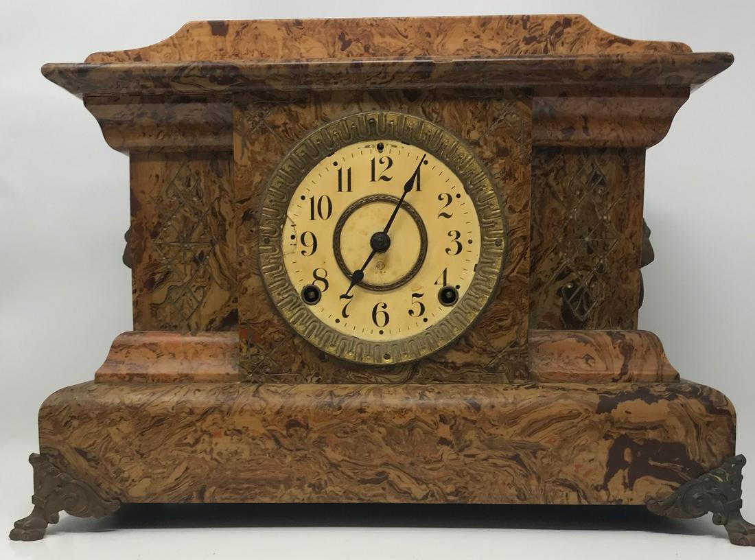 S.T. Seth Thomas USA mantel/mantle Clock: Description: Seth Thomas S.T. USA mantel/mantle Clock, 16" length x 11.5" height;Bakelite brown faux marble, marble-like design;metal lion's feet;metal lion's head ring handles on sides;S over T desig