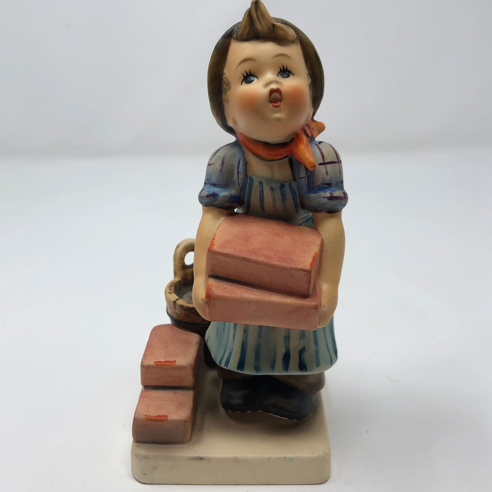 Vintage Hummel Goebel #305, "The Builder", TMK-6: Description: Vintage Hummel Goebel #305, "The Builder", TMK-6. Expressive figurine is signed along base; 3 line trademark with bee on underside. Made in W. Germany. Measurement: approximate 5.75" (INC