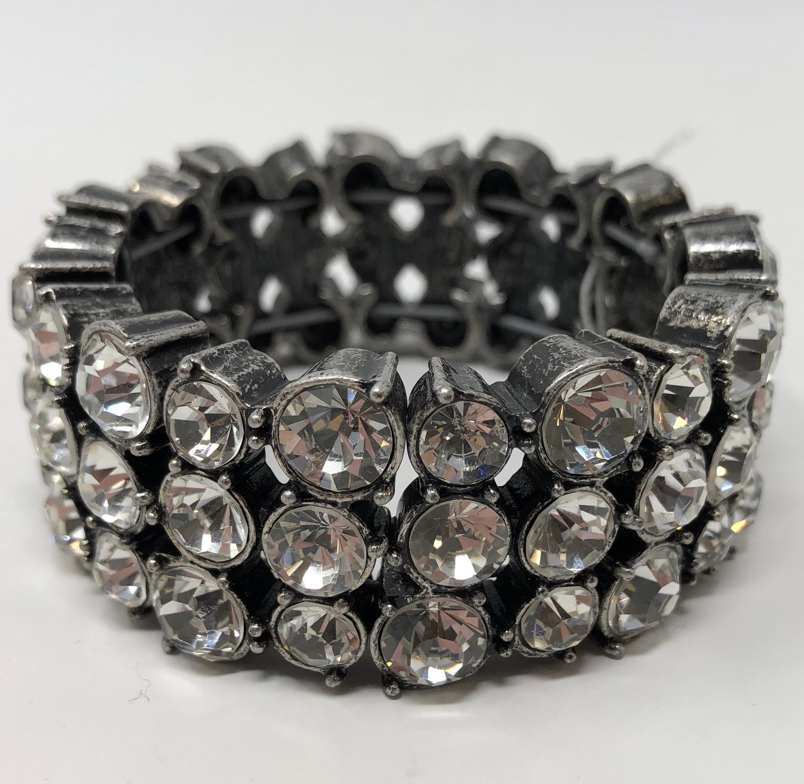 Clear stone stretch wrist bracelet: Clear stone stretch wrist bracelet, 3 stones to a row approx 3" diameter, width 1"; Shipping cost $12. Different rate to California, Alaska, Hawaii and all international apply.
