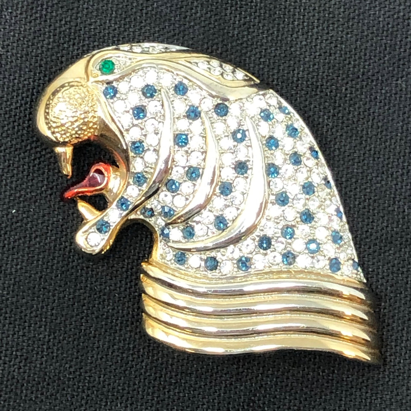 Silver ton Metal & Crystal Glass Stone Walrus Brooch: Silver ton Metal & Crystal Glass Stone Walrus Brooch with multi colored stones; approx measurements 2.25" x 2.25"; Shipping cost $12. Different rate to California, Alaska, Hawaii and all international
