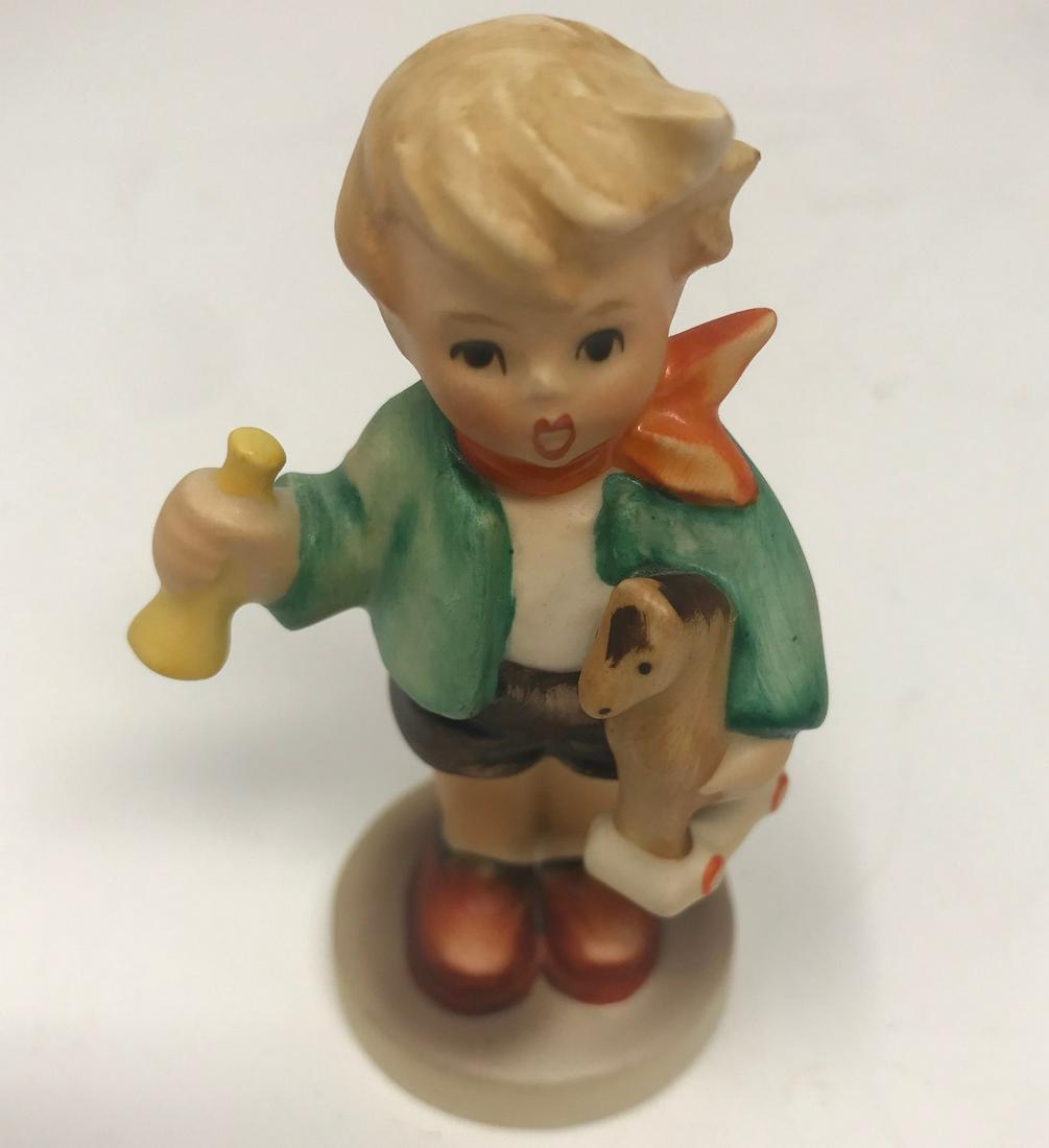 Vintage Goebel Hummel Boy w/ a Horse, #239: Description: Adorable vintage Goebel Hummel porcelain figurine #239, "Boy w/ a horse." Retains silver paper label copyright GOEBEL, West Germany. Inscribed with 1967; signed on base. Material: porcela