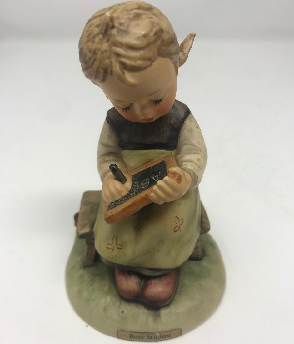Goebel Hummel Figurine, Busy Student: Description: Vintage Goebel Hummel porcelain figurine, "Busy Student" #367, 1963. Damage to lower portion of head, one of her curls is missing; however, item can be displayed so missing hair is not vi