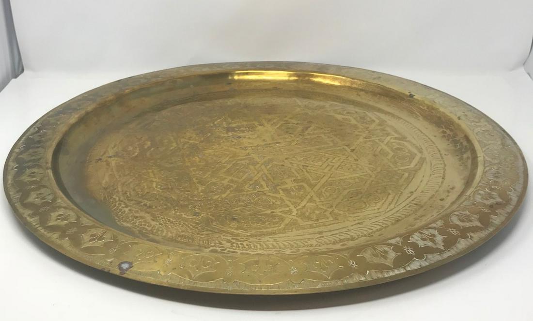 Gorgeous Polished Brass Engraved Moroccan Tray: Description: Moroccan polished Brass engraved tray - 21'' Diameter. Table is artistically hand-hammered with a traditional pattern design. Measurement approximate: Tray- 21Ã‚Â” wide. Material: B