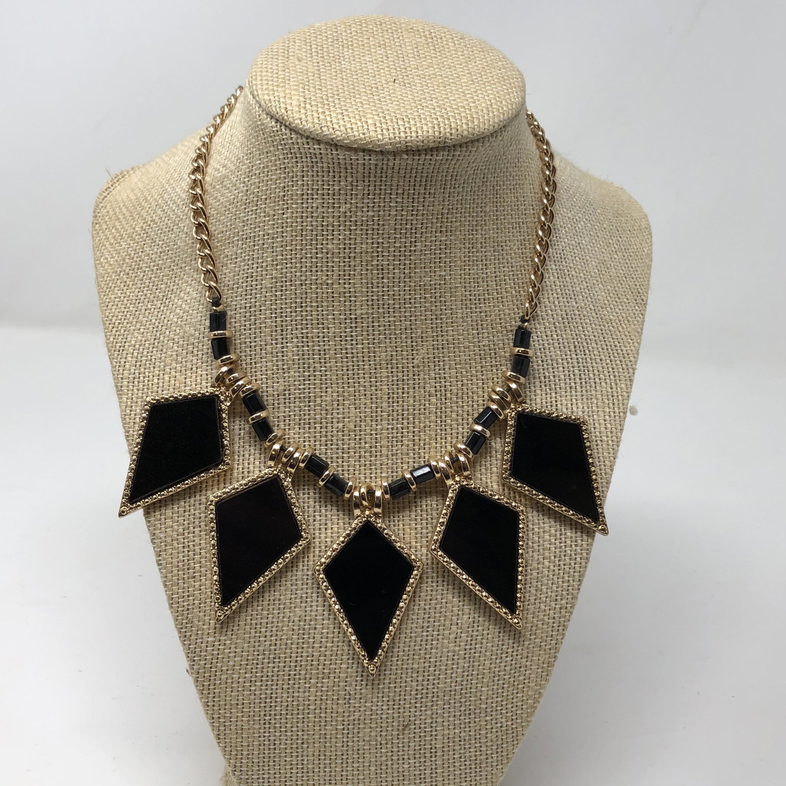 Black spacer bead and gold colored link chain 17": Black spacer bead and gold colored link chain 17" approx measurements 5 pendant; Shipping cost $12. Different rate to California, Alaska, Hawaii and all international apply.