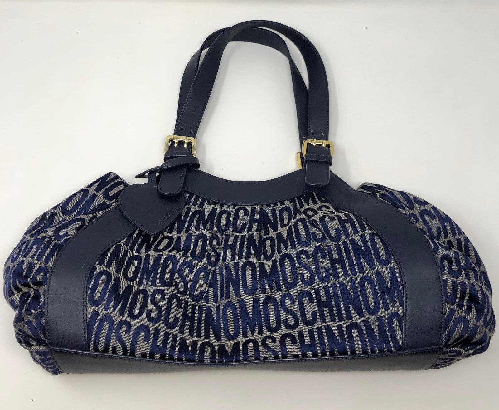 MOSCHINO repeating logo moschino MOSCHINO canvas and: MOSCHINO repeating logo moschino MOSCHINO canvas and leather black and grey bag with leather straps , GOLD tone CLASPS, BUCKLES ; 13 X 8 X 4 inches NO. 883331315 A NOATOSS8831628 ; Shipping cost $20. 