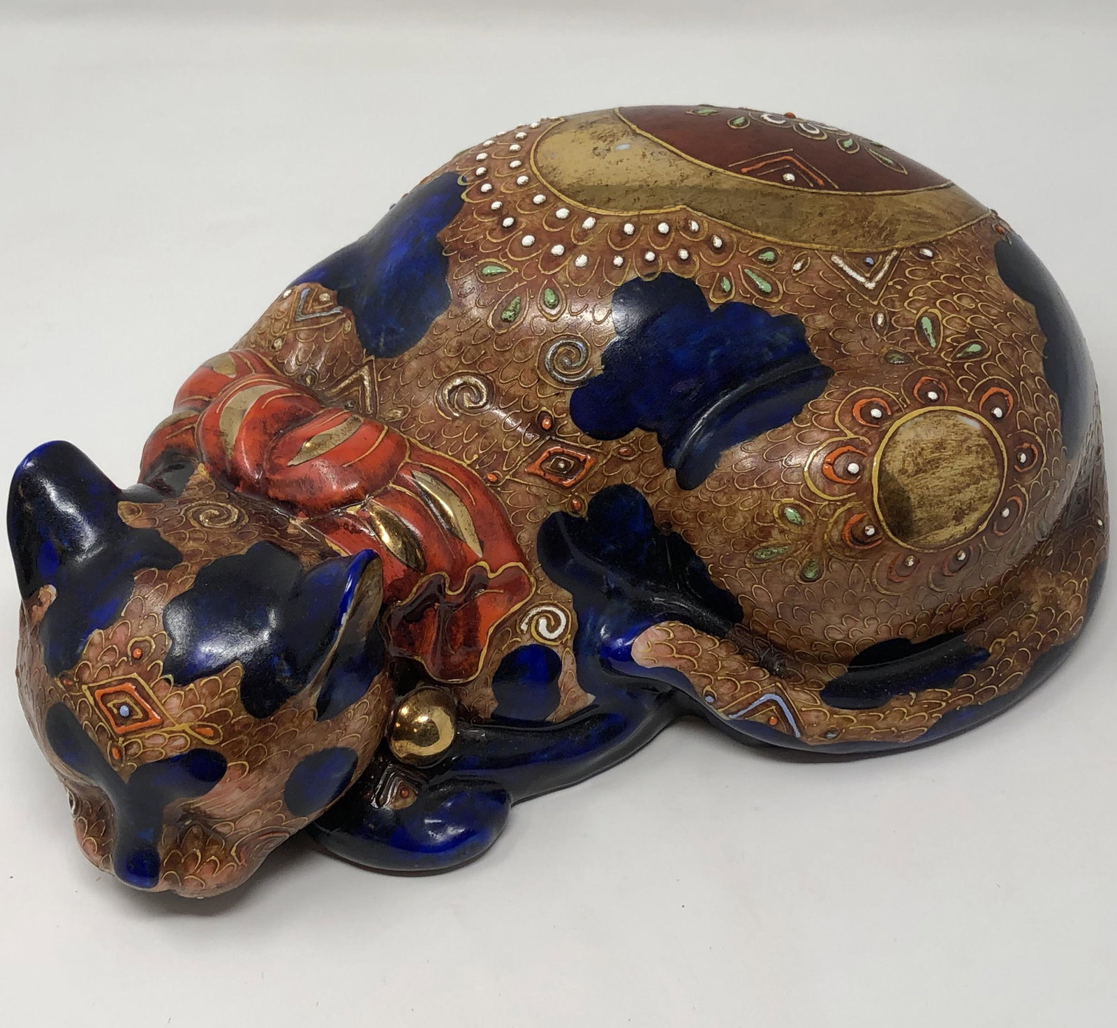 Porcelain cat statue, ornately handpainted gilted &: Porcelain cat statue, ornately handpainted gilted & red, blue; 11 x 4 x 6 inches approx. measurements; Shipping cost: $35. Different rate to California, Alaska, Hawaii and all international apply.