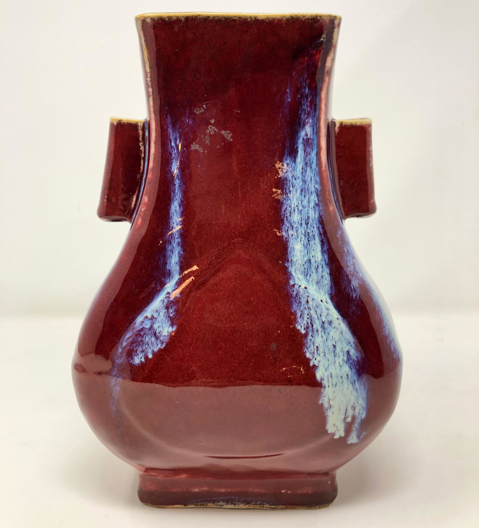 Qing Dynasty burgundy wine color porcelain vase: Qing Dynasty burgundy red wine color porcelain twin handled vase, bottom marked; Approximate measurements: 9" H, all measurements are approximate and in inches; Material: porcelain; Shipping cost: $25