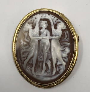 Three Graces Cameo in Gold toned mount Pin Brooch: Three Graces Cameo in Gold toned mount Pin BroochApproximate measurements: 1.25 x 1 inch;Materials: gold tone metal, brown & white cameo stone;Condition: used, good;Shipping cost: $12. Different