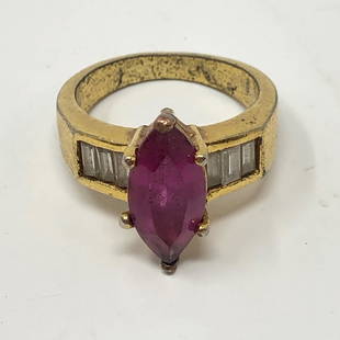 Ladies Amethystyle & clearstone ring: Ladies Amethystyle & clearstone ringApproximate measurements: 1 inch diameter;Materials: gold tone metal, clear white stones, red clear stone+C86;Condition: used, good;Shipping cost: $12. Different