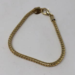 Gilted gold tone braded chain clasp bracelet: Gilted gold tone braded chain clasp braceletApproximate measurements: 7 inches total length ;Materials: Metal;Condition: used, good;Shipping cost: $12. Different rate to California, Alaska, Hawaii