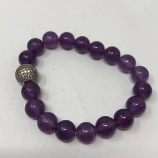 Purple Beads & Sparkly Globe stretchy with tiny stones: Purple Beads & Sparkly Globe stretchy with tiny stones aglitterApproximate measurements: 3 inches round;Materials: Beads, metal;Condition: used, good;Shipping cost: $12. Different rate to