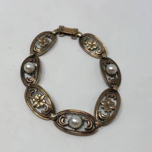 SYMMETALIC Sterling SILVER + 14K GOLD link bracelet: SYMMETALIC Sterling SILVER + 14K GOLD link bracelet 7.5" Approximate measurements: 7.5 inch total length, 0.5 inches wide ; Materials: SILVER, GOLD, metal, faux pearl; Condition: used, good;