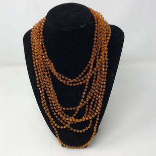 VINTAGE AMBER 4 strand AMBER Beads clasp necklace: VINTAGE AMBER 4 strand AMBER Beads clasp necklaceApproximate measurements: 45 inches total length unclasped, amber beads about 5 to an inch;Materials: Amber beads, metal, string or fabric;Condition: