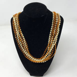 VINTAGE Amber & White Bead 4 strand necklace gold tone: VINTAGE Amber & White Bead 4 strand necklace gold tone claspApproximate measurements: 48 inches total length;Materials: Amber and white beads;Condition: used, good;Shipping cost: $12. Different rate