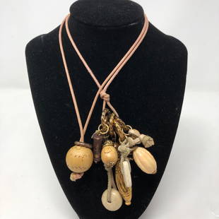 Wild Dangles Beads Bangles & Glitz Metal Statement au: Wild Dangles Beads Bangles & Glitz Metal Statement au Natural Say it with goldtone and wild gourd, goldish rings wood beads & a light brown stone. It says YOU or whatever you LIKEâ€¦ Approximate