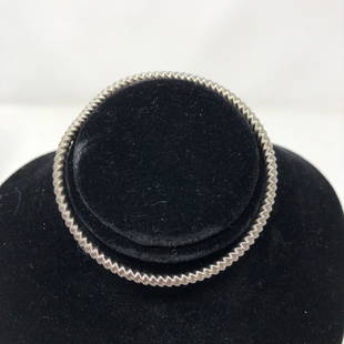 Springy Silvery Wrist Stretch Bracelet #1: Springy Silvery Wrist Stretch Bracelet #1Approximate measurements: 2.5 inches round, springy expandable;Materials: metal, fabric;Condition: used, good;Shipping cost: $12. Different rate to