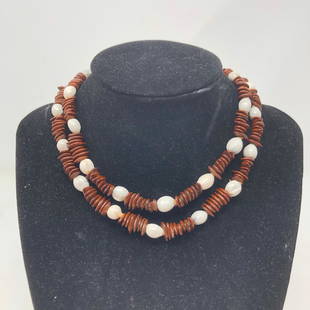 Brown plate discs & white nutshelly beads necklace #3: Brown plate discs & white nutshelly beads necklace #3Approximate measurements: 28 inches;Materials: Wood or plastique;Condition: used, good;Shipping cost: $12. Different rate to California, Alaska,