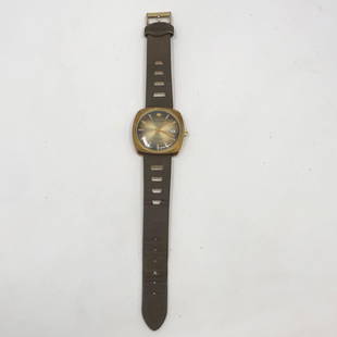 BUCHERER 1887 water resistant swiss mad anti magnetic: BUCHERER 1887 water resistant swiss mad anti magnetic automatic shock resistant brown leather strap 9 inch total lengthApproximate measurements: 9 inch total length;Materials: metal, leather,