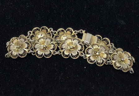 Ornate silver pressed metal flowers clasp bracelet 7.5": Ornate silver pressed metal flowers clasp bracelet 7.5" totalApproximate measurements: 7.5 round x 0.5 inches;Materials: metal;Condition: used, good;Shipping cost: $12. Different rate to California,