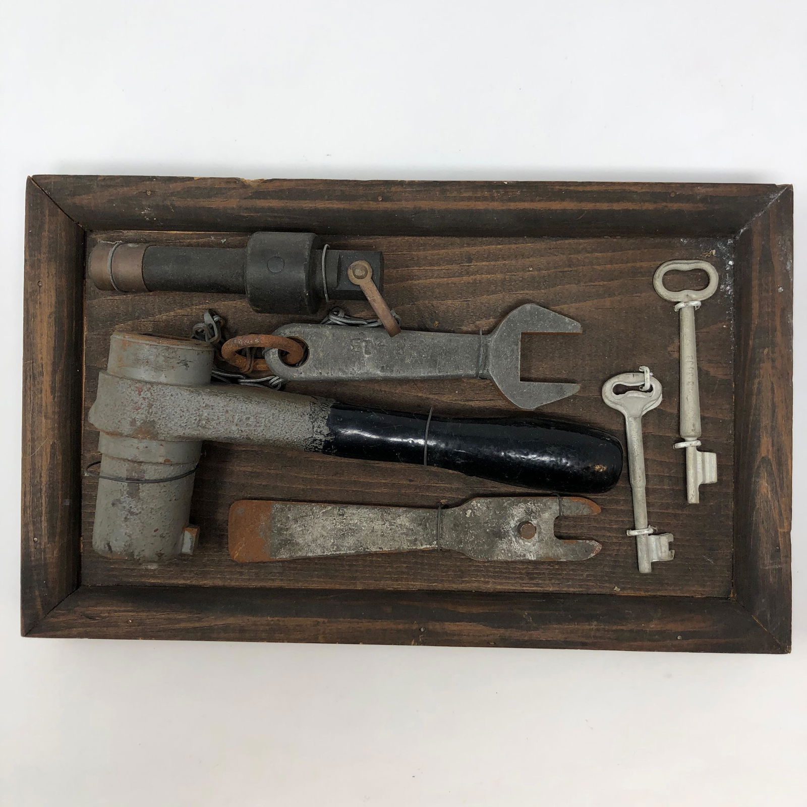 Antique Train Steering Wheel tools and room Keys: Antique train Steering wheel tools and room keys. Wall hanging. ;Material: Metal; Measurement approximate: 12 L x 7 H; Shipping cost: 25. Different rate to California Alaska and Hawaii apply.; NOTE: T