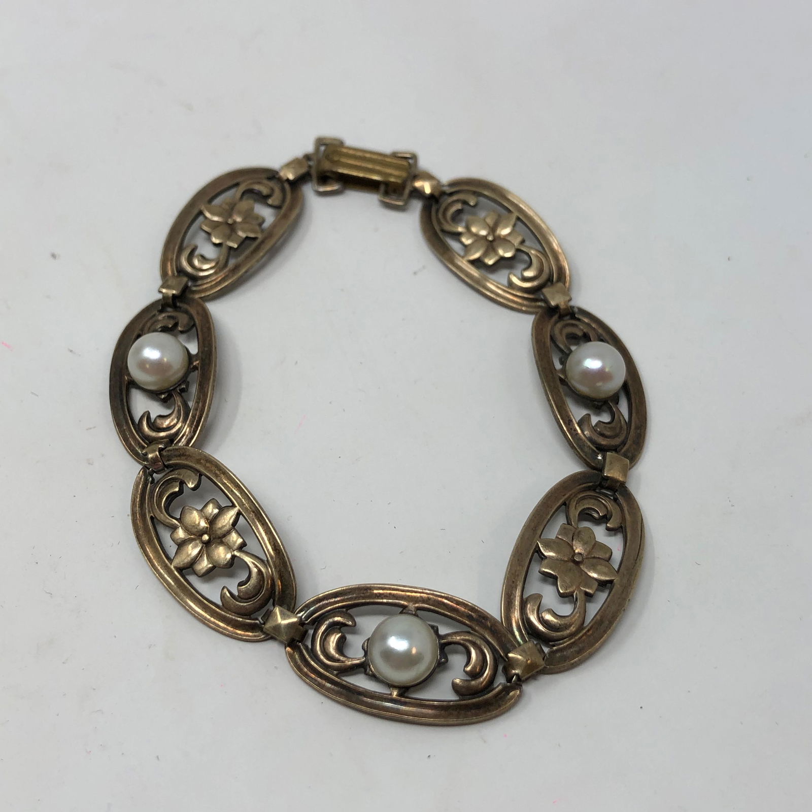 SYMMETALIC Sterling SILVER + 14K GOLD link bracelet: SYMMETALIC Sterling SILVER + 14K GOLD link bracelet 7.5" Approximate measurements: 7.5 inch total length, 0.5 inches wide ; Materials: SILVER, GOLD, metal, faux pearl; Condition: used, good; Shipping