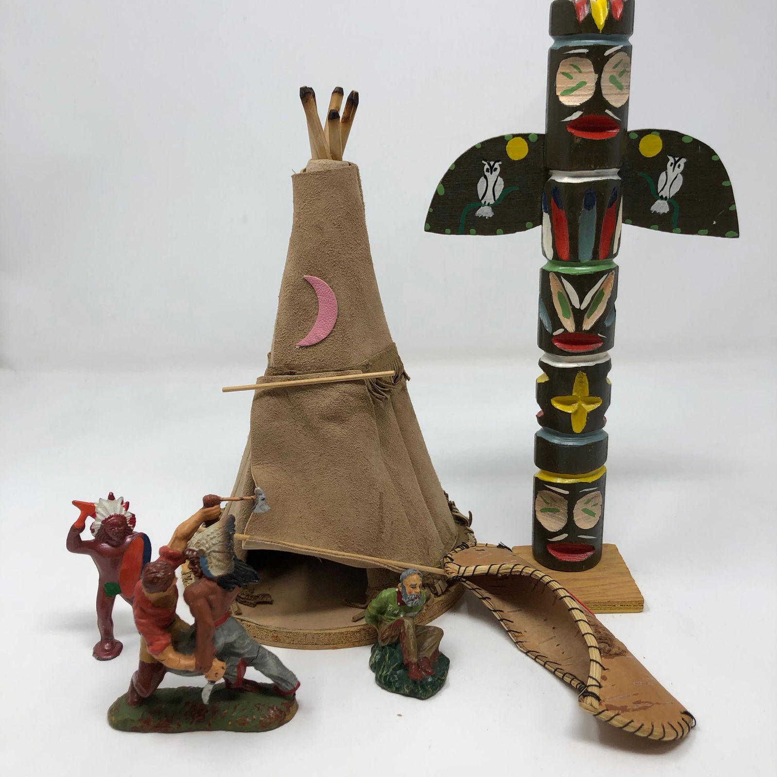 Antique Six Native American Indian camp figurines: Antique six Native American Indian camp figurines. Bottom marked. See images;Material: Metal/Linen;Measurement approximate: 2” â€“ 10” ;Shipping cost: 25. Different rate to California