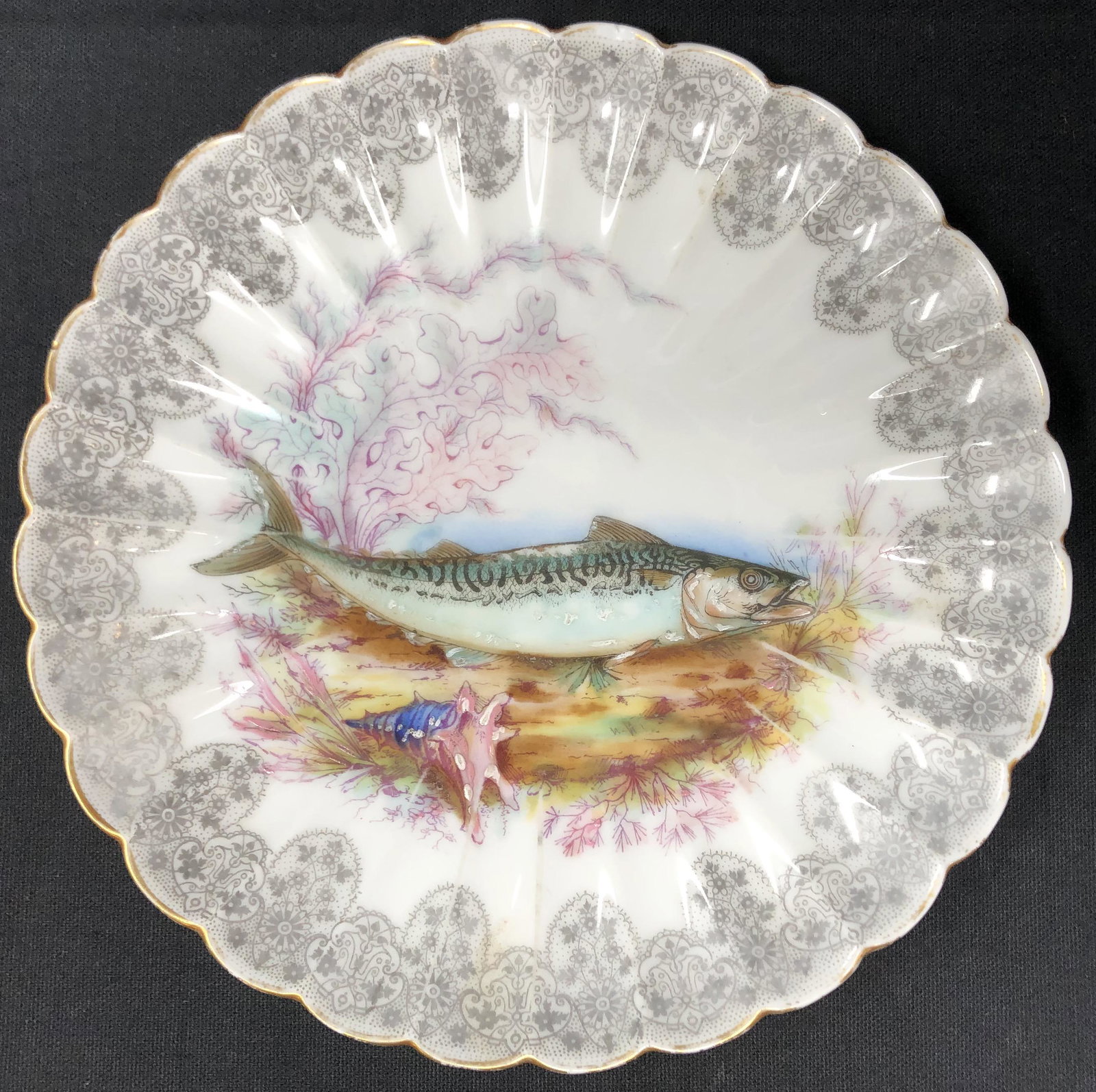Signed Limoges Plate W/ Fish design: Description: Signed Limoges Plate W/ Fish design. Measurement approximate: 9” W; Material: Porcelain; Shipping cost: $17 Different rate to California, Hawaii and Alaska applies.