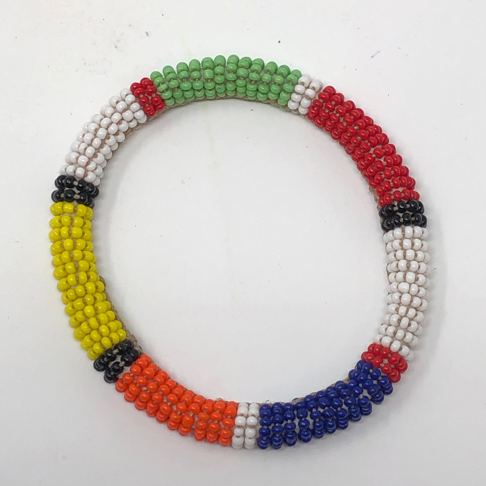 NATIVE AMERICAN INDIAN 3 inch beaded slip on bracelet: NATIVE AMERICAN INDIAN 3 inch beaded slip on bracelet Approximate measurements: 3 inches diameter, 0.33 inches wide Materials: beads, fabric. Shipping cost: $9. Different rate to California, Alaska, H