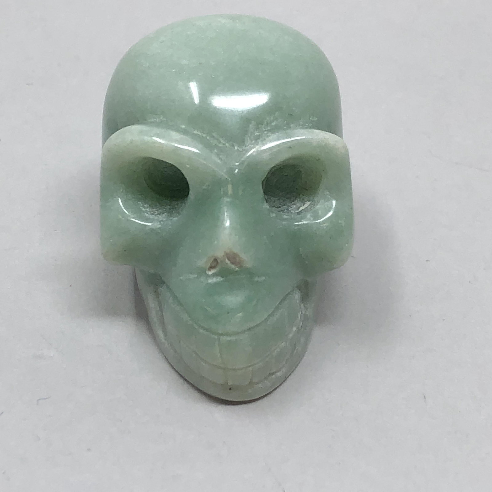 Polished Green Jade SKULL: Polished Green Jade SKULL Approximate measurements: 1.75 x 1 x 1.5 inches Materials: jade Shipping cost: $5.