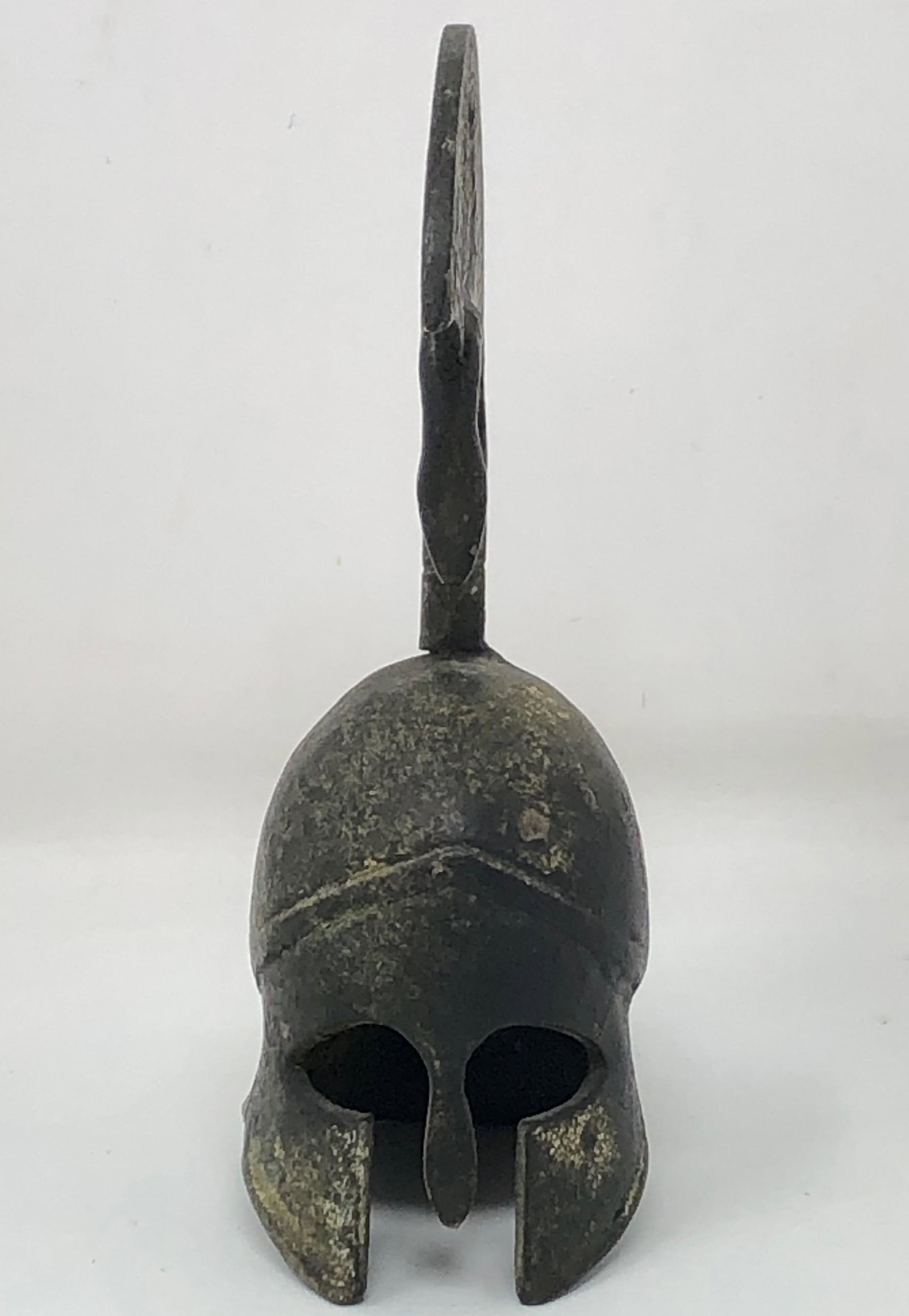 *antique* GREEK helmet: Antique GREEK helmet Approximate measurements: 5 x 3 x 2 inchesMaterials: cast metal, bronze or ironCondition: GoodShipping cost: $12. Different rate to California, Alaska, Hawaii and all Internationa