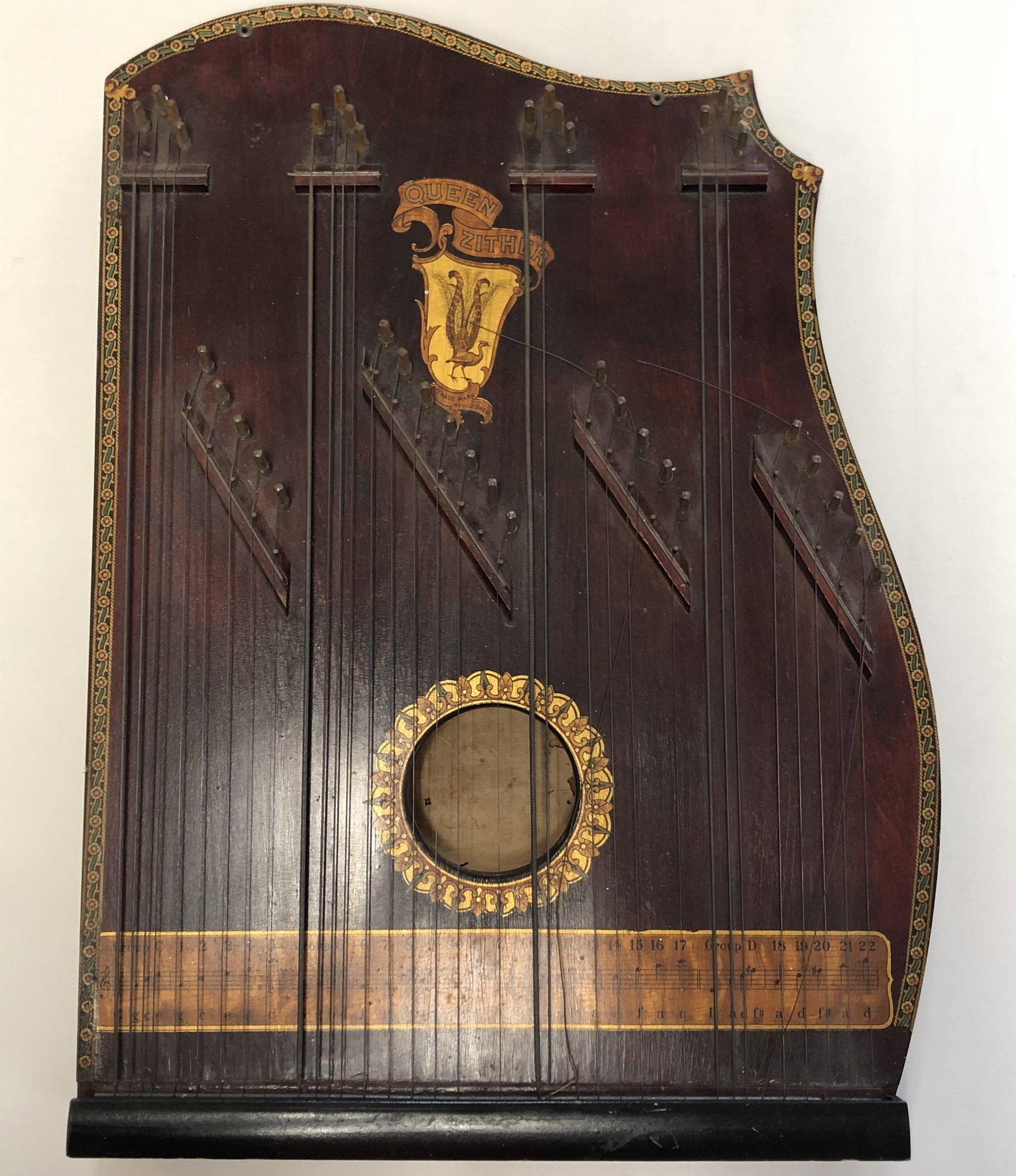 Antique Queen Zither late 19th or early 20th century 4: Antique Queen Zither late 19th or early 20th century 4 chords, scarce innovative 4 chord and bass string system with musical staff design. Approximate measurements: 20 x 14.5 inches Materials: wood, m