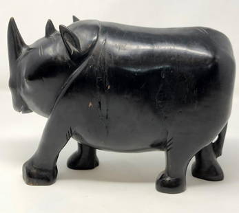 Robust Wood Carved rhinoceros Statue: Robust Wood Carved rhinoceros Statue. Approximate measurements: 10 x 7 x 3.5 inches. Materials: Robust wood. Shipping cost: $25. Different rate to California, Alaska, Hawaii and all International