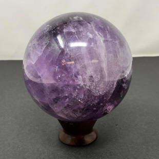 Amethyst Gemstone Swirling Globe on base: Amethyst Gemstone Swirling Globe on base. Approximate measurements: 5.25 x 4.25 x 4.25 inches. Materials: Amethyst gemstone, wood. Shipping cost: $15. Different rate to California, Alaska, Hawaii