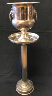 Antique SHEFFIELD Silver plate Champagne Service: Antique SHEFFIELD Silver plate Champagne Service on Stand. Lions head ring handles. Approximate measurements: Total: 30 H x 9 (diameter across top) inches. Outer silver plated bucket: 11 inches