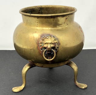 Antique Brass Lion Head Ring Handle 3 footed planter: Antique Brass Lion Head Ring Handle 3 footed planter. Approximate measurements: 4.5 x 4.5 inches Materials: Brass Shipping: $12. Different rate to California, Alaska, Hawaii and all International