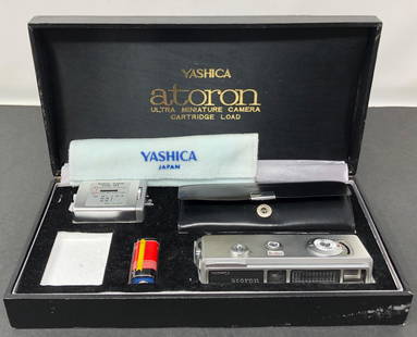 YASHICA Atoron Ultra Mini SPY CAMERA: YASHICA Atoron Ultra Mini SPY CAMERA. With accessories. See photos. Untested. 1.Approximate measurements: 9 x 4.75 x 1.75 in case. Materials: Metal, wood, board, fabric. Shipping cost: $45.