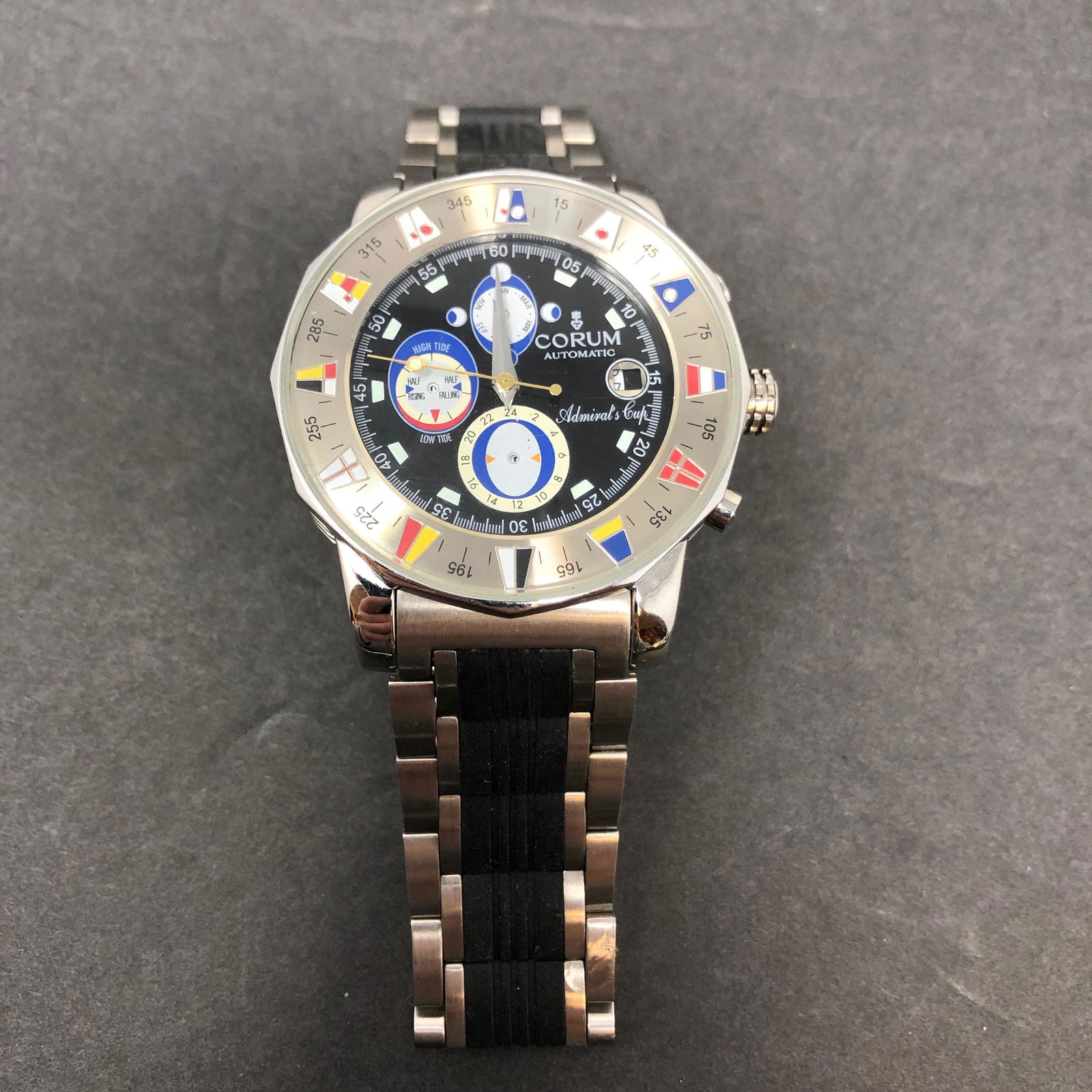 CORUM Admirals Automatic Stainless Steel Watch Swiss: Description: CORUM Admirals Automatic Stainless Steel Watch Swiss Cert ChronographApproximate measurements: 1.5 inch face, 8 inches total length Materials: Stainless steel, glass, rubberlike fabric Sh