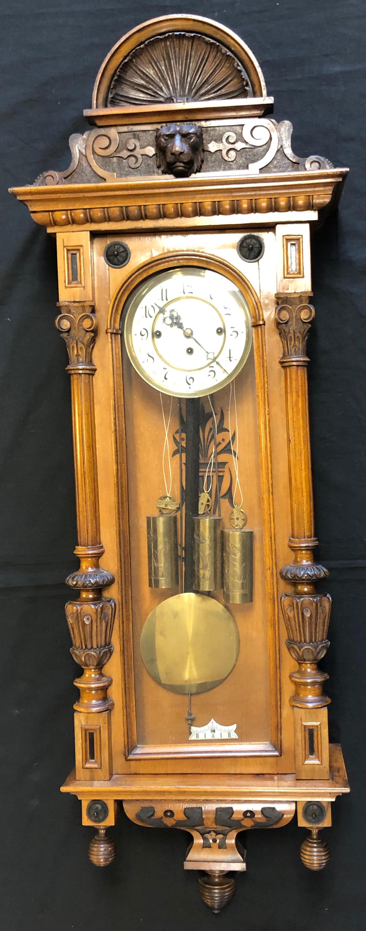 Antique Austrian German Wall clock W. Pendulum/ Weights: Description: Antique Austrian German Wall clock W. Pendulum/ 3 WeightsMaterial: Wood Measurement approximate: 50 H x 14 W”Shipping Cost: Pick up only