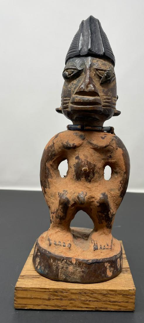 Early 20th Century Yoruba Ibeji twin Figurine: Early 20th Century Yoruba Ibeji twin Figurine, Measurement approximate: 10.5 H. (Inches). Material: Wood. Shipping cost: $25 Different rate to California, Hawaii and Alaska apply