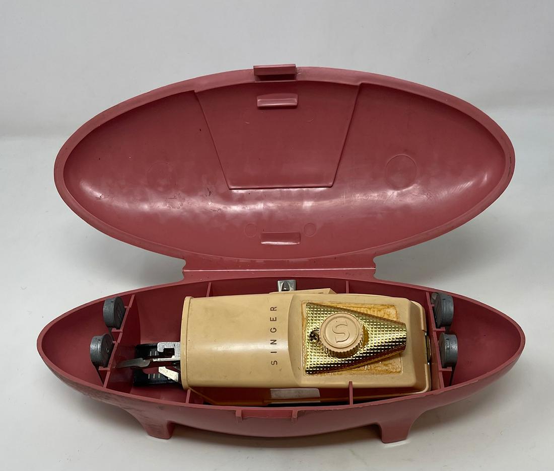 Vintage Singer Sewing Machine Pink Buttonholer w: Description: Vintage Singer Sewing Machine Pink Buttonholer w Attachments Approximate measurements: Machine in case: 11 x 3 x 5 inches, Attachments box: 6 x 2.5 x 2 inches. Materials: Plastic, metal,