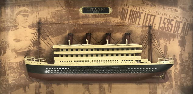 1912 TITANIC Model Ship in Wooden Shadow Box Glass Framed: Description: 1912 TITANIC Model Ship in Wooden Shadow Box Glass Framed, with newspaper front page / headline repro of sinking story. Approximate measurements: 23.5 x 13.25 x 3 inches. Materials: