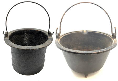 (2) Antique Early American Cast Iron Hanging Pots: Description: (2) Antique Early American Cast Iron Hanging Pots . Approximate measurements: 12 and 10 inches across top diameter respectively. Materials: metal. This item has a reserve price.