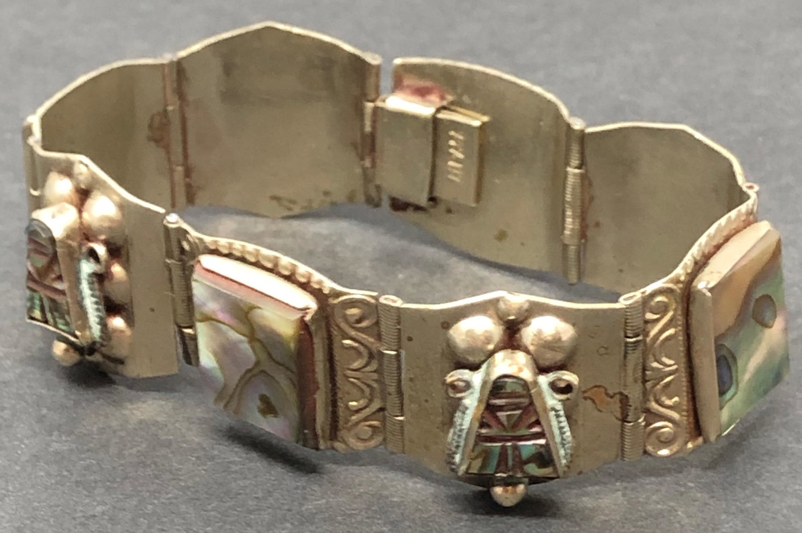 ALPACA Silver 8 Section Silver Bracelet: Description: ALPACA Silver 8 Section Silver Bracelet, stamped ALPACA Approximate measurements: 7.5 inches Materials: Silvertone or silverplate metal, rainbow stone discs. TERMS & CONDITIONS SHIPPING: 