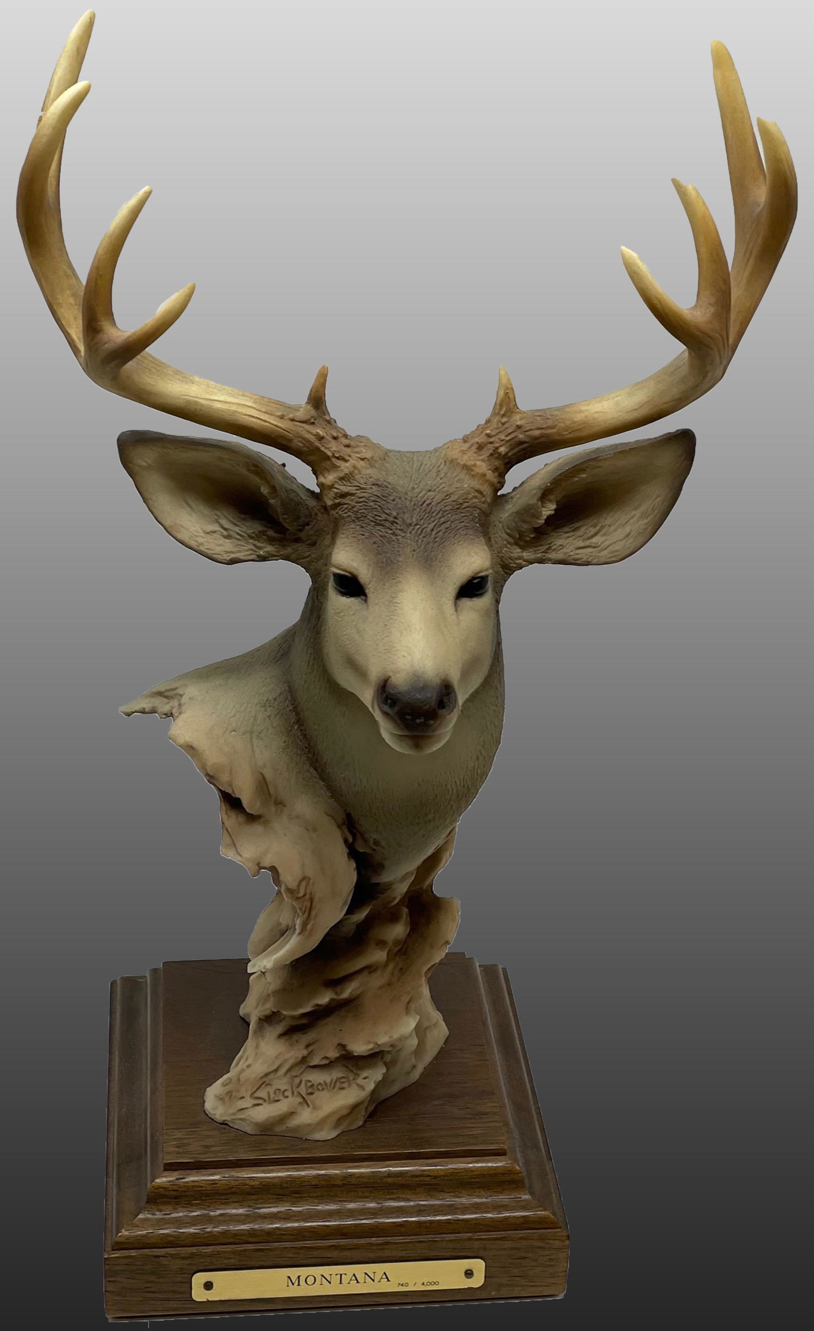 Joe Slockbower MONTANA Mule deer figurine/ Limited Edition: 740/4000: Description: Joe Slockbower MONTANA Mule deer figurine/ Limited Edition: 740/4000. Item is bottom signedMeasurement approximate: 15 H Material: Ceramic & Porcelain, Granite, Wood